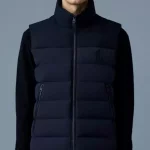 Veste Mackage sans manches en duvet ultraléger recyclé. Extérieur matelassée en tissu extensible bidirectionnel offre un grand confort.